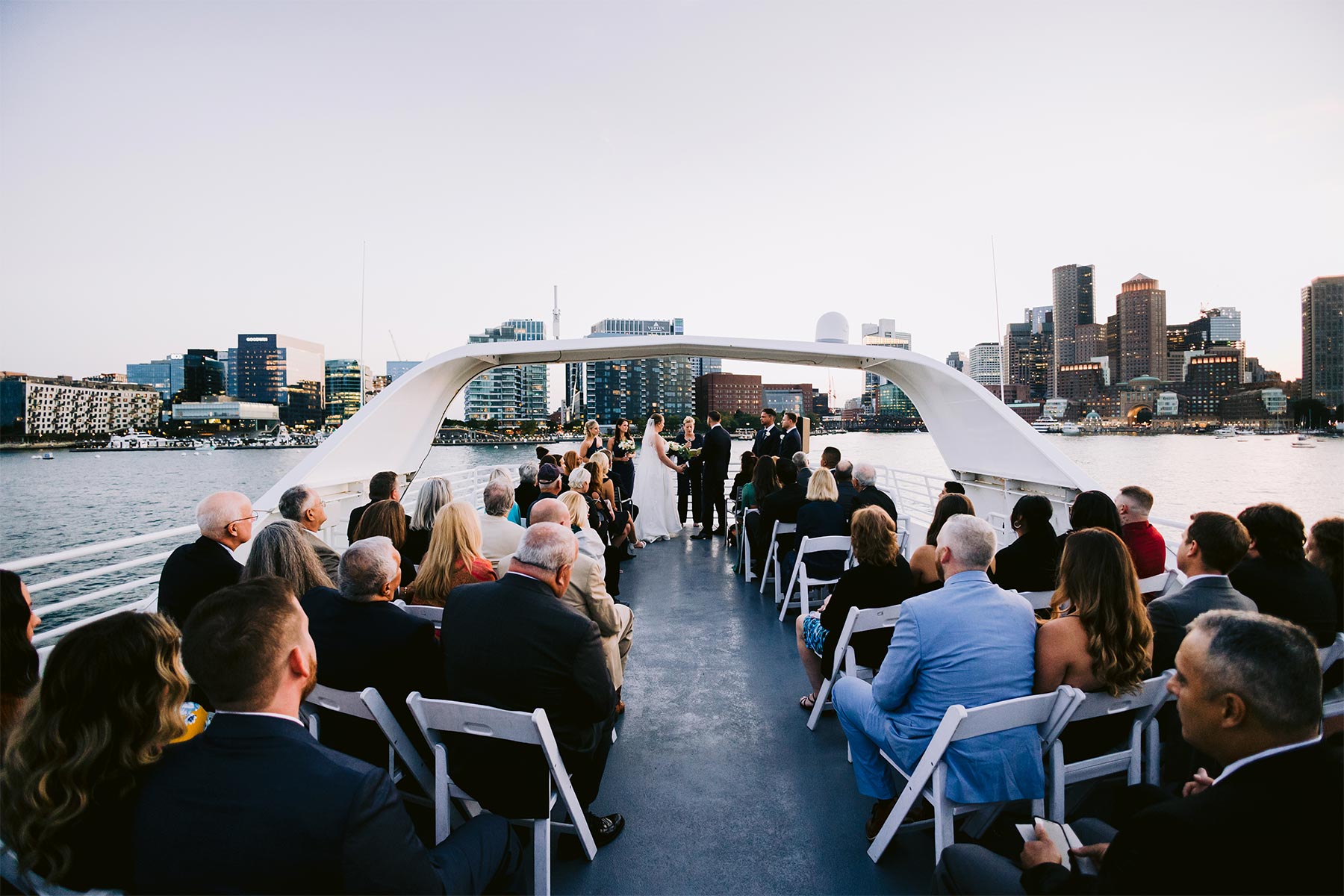 Boston elite yacht wedding ceremony sunset.