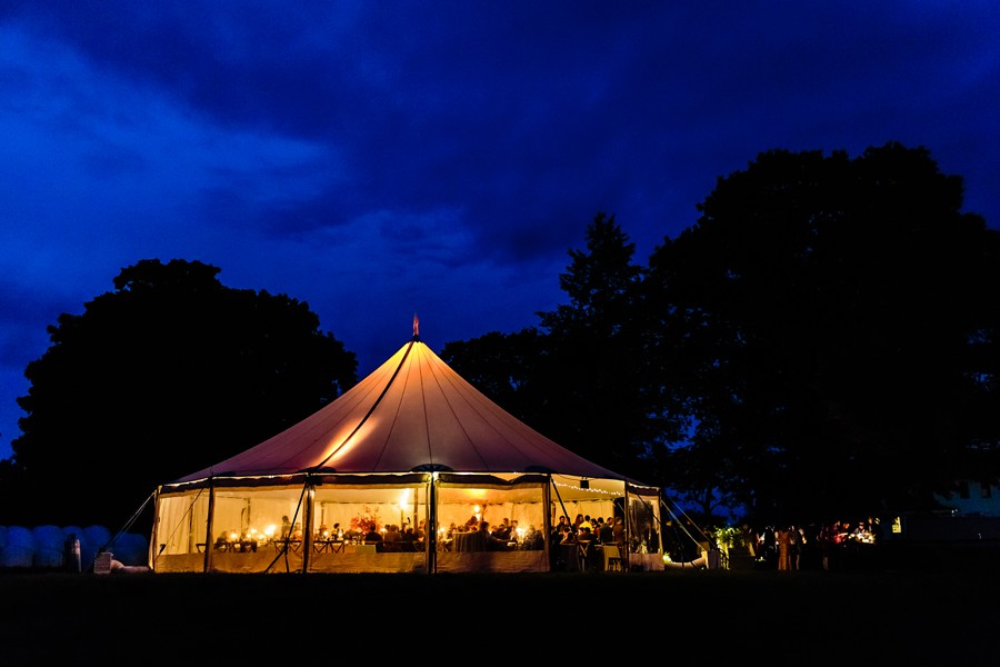 Romantic candle lit tent wedding.