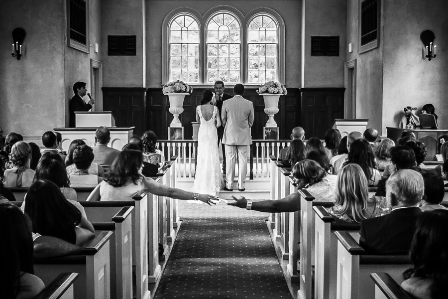Wayside inn martha mary chapel wedding ceremony handing notes.